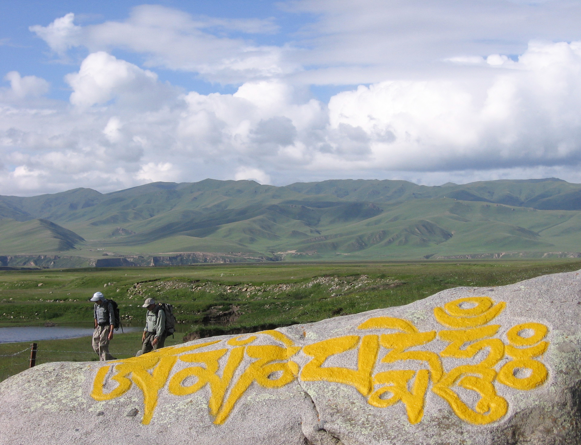 Professors Douglas Burbank (UCSB) and Eric Kirby (Pennsylvania State University) conduct fieldwork on the active Kunlun fault that cuts across Buddhist Tibet near the Yellow River. Strike-slip displacement on the Kunlun fault terminates near the northeastern margin of the Tibetan Plateau (see Kirby et al., Tectonics, 2007) in an area where the Yellow River is rapidly incising headward (see Harkins et al., JGR, 2007).

